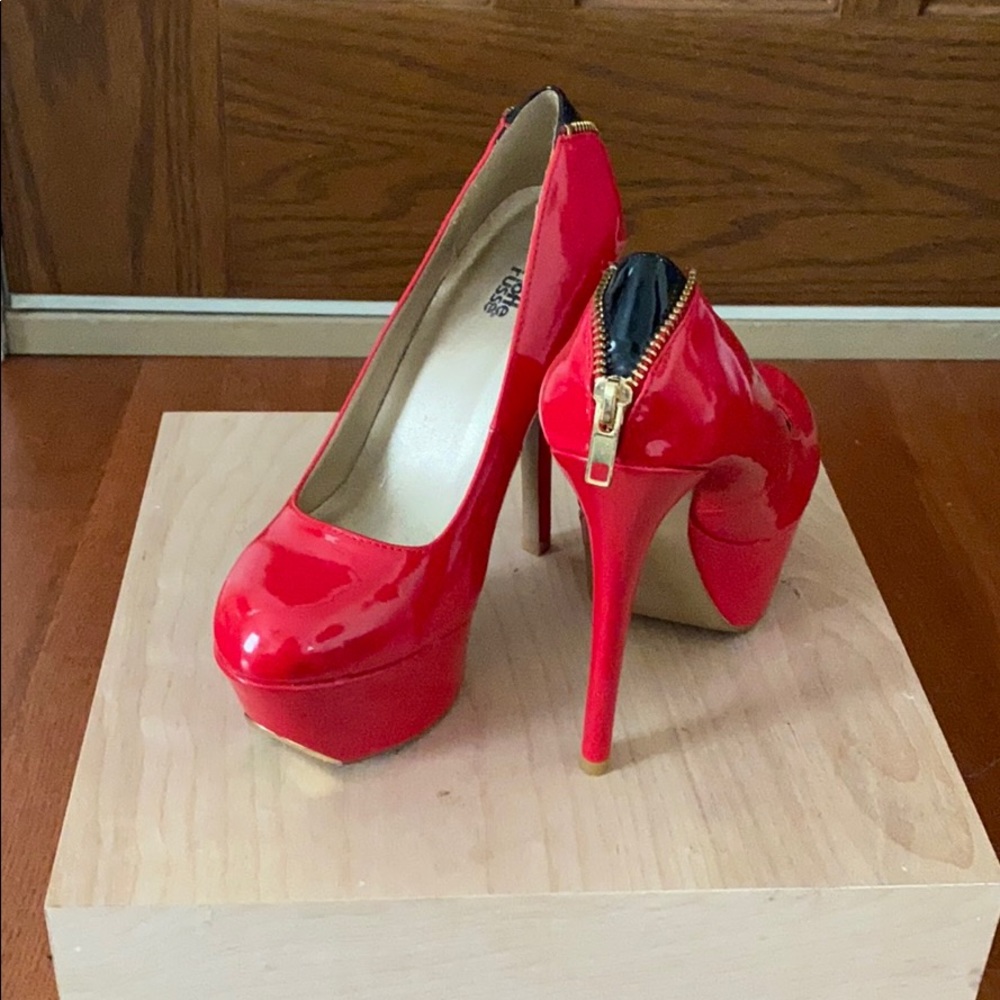 Red high heels with gold zipper